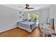 Comfortable bedroom with a ceiling fan and a window, providing a bright and airy atmosphere at 209 Wildwood Way, Canton, GA 30114
