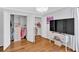 Chic bedroom with open closets, a desk, and a window, creating a stylish and functional space at 209 Wildwood Way, Canton, GA 30114
