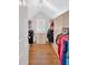 Spacious walk-in closet with custom shelving and ample storage space for clothing and accessories at 209 Wildwood Way, Canton, GA 30114