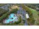 Aerial view of neighborhood pool, clubhouse, golf course, parking and surrounding green space at 209 Wildwood Way, Canton, GA 30114