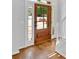 Wood front door with sidelights that open up to hardwood floors at 209 Wildwood Way, Canton, GA 30114