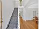 Bright foyer with staircase, hardwood floors, and neutral paint at 209 Wildwood Way, Canton, GA 30114