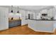 Bright, modern kitchen with custom cabinets, stainless steel appliances and hardwood floors at 209 Wildwood Way, Canton, GA 30114
