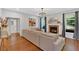 Open living room featuring a fireplace, hardwood floors, and neutral paint at 209 Wildwood Way, Canton, GA 30114