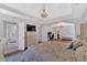 Luxurious main bedroom with a chandelier, trey ceiling, and en suite bathroom and office at 209 Wildwood Way, Canton, GA 30114