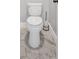 Close-up of a toilet with stylish hexagonal tile flooring and modern fixtures at 209 Wildwood Way, Canton, GA 30114
