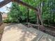 Wooden deck in backyard surrounded by mature trees and greenery at 3177 Westfield Ne Way, Roswell, GA 30075