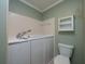 Well-lit bathroom with a walk-in tub and toilet at 3177 Westfield Ne Way, Roswell, GA 30075
