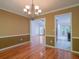 Open-concept dining room with hardwood floors flows into the living room and kitchen at 3177 Westfield Ne Way, Roswell, GA 30075
