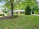 Charming single-Gathering home boasts a two-car garage and a well-manicured front lawn at 3177 Westfield Ne Way, Roswell, GA 30075