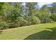 Lush backyard with extensive greenery and a well-maintained lawn, perfect for outdoor enjoyment at 3264 Andante Ne Dr, Marietta, GA 30062