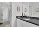 Clean bathroom featuring modern fixtures, white cabinetry, and a sleek vanity with a large mirror at 3264 Andante Ne Dr, Marietta, GA 30062