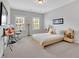 Bright bedroom with soft decor, two windows and contemporary furniture, creating a cozy, inviting space at 3264 Andante Ne Dr, Marietta, GA 30062