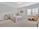 Relaxing bedroom with a cozy chair and soft natural light filtering through shuttered windows at 3264 Andante Ne Dr, Marietta, GA 30062