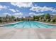 Community pool with lounge chairs and landscaped surroundings at 3264 Andante Ne Dr, Marietta, GA 30062