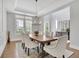 Open-concept dining room with hardwood floors and a stylish chandelier, perfect for gatherings and entertaining at 3264 Andante Ne Dr, Marietta, GA 30062