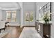 Bright foyer with hardwood floors, decorative rug, and ample natural light, creating a welcoming entrance at 3264 Andante Ne Dr, Marietta, GA 30062