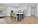 Bright open kitchen featuring stainless steel appliances, a large island with seating, and ample white cabinetry at 3264 Andante Ne Dr, Marietta, GA 30062
