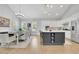 Spacious eat-in kitchen with a large island, stainless steel appliances, and hardwood floors under a high ceiling at 3264 Andante Ne Dr, Marietta, GA 30062