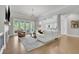 Bright and open living room with hardwood floors, French doors, and a modern fireplace, perfect for entertaining at 3264 Andante Ne Dr, Marietta, GA 30062