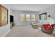 Inviting living room with large windows, cozy seating, and a modern entertainment setup at 3264 Andante Ne Dr, Marietta, GA 30062