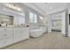 Bright main bathroom boasts a soaking tub, separate vanities, walk-in shower, and natural light from windows at 3264 Andante Ne Dr, Marietta, GA 30062