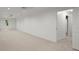 Spacious basement features neutral carpeting, abundant natural light, and a doorway at 4085 Tritt Homestead Dr, Marietta, GA 30062