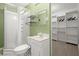 Bathroom with a walk-in shower, toilet, sink, and a closet with shelving at 4085 Tritt Homestead Dr, Marietta, GA 30062