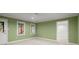 Spacious bedroom featuring neutral carpet, green walls, and natural light from the windows at 4085 Tritt Homestead Dr, Marietta, GA 30062