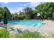 Large community pool surrounded by lounge chairs and umbrellas, perfect for relaxation and recreation at 4085 Tritt Homestead Dr, Marietta, GA 30062