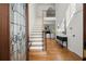 Bright foyer with hardwood floors, staircase, and decorative glass front door at 4085 Tritt Homestead Dr, Marietta, GA 30062
