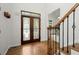 Elegant foyer showcasing hardwood floors, stained glass door and staircase at 4085 Tritt Homestead Dr, Marietta, GA 30062