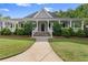 Charming single-Gathering home with a welcoming front porch, stone accents, and beautifully landscaped yard at 4085 Tritt Homestead Dr, Marietta, GA 30062