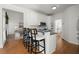 Kitchen with bar seating, stainless steel microwave and oven, and hardwood floors at 4085 Tritt Homestead Dr, Marietta, GA 30062
