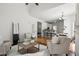Open concept living room flowing to the kitchen, with a fireplace and lots of natural light at 4085 Tritt Homestead Dr, Marietta, GA 30062