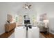 Open living room with a vaulted ceiling, a fireplace, and large windows for ample natural light at 4085 Tritt Homestead Dr, Marietta, GA 30062