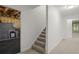 Staircase leading down to basement with carpeted steps and a view of finished basement at 4085 Tritt Homestead Dr, Marietta, GA 30062