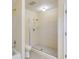Bright bathroom features a glass-enclosed shower, tiled walls, and tile flooring at 5124 Vermack Rd, Dunwoody, GA 30338