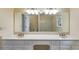 Bright bathroom with double vanity, large mirror, and separate toilet and shower areas at 5124 Vermack Rd, Dunwoody, GA 30338