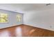 Spacious bedroom features hardwood floors and double windows at 5124 Vermack Rd, Dunwoody, GA 30338