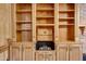 Custom built-in wooden cabinets with sink, drawers, and shelves at 5124 Vermack Rd, Dunwoody, GA 30338