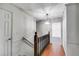 Hallway features a wood railing and trim and hardwood floors at 5124 Vermack Rd, Dunwoody, GA 30338