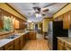 Traditional kitchen with stainless steel refrigerator, double sink, and wooden cabinets at 5124 Vermack Rd, Dunwoody, GA 30338