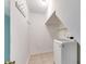 Bright laundry room with modern washer, coat hooks and tile flooring at 5124 Vermack Rd, Dunwoody, GA 30338