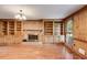 Living room with brick fireplace, custom built-ins and hardwood floors at 5124 Vermack Rd, Dunwoody, GA 30338