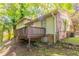 Exterior view of the home with a deck and backyard at 802 San Miguel Dr, Stone Mountain, GA 30083