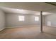 Spacious unfinished basement with carpet, natural light from windows, and painted walls at 802 San Miguel Dr, Stone Mountain, GA 30083