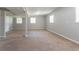Spacious unfinished basement with carpet, natural light from windows, and painted walls at 802 San Miguel Dr, Stone Mountain, GA 30083