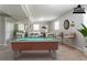 A virtually staged basement with a pool table, dart board, and a seating area at 802 San Miguel Dr, Stone Mountain, GA 30083