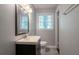 Bathroom with a vanity, mirror, and a window that provides natural light at 802 San Miguel Dr, Stone Mountain, GA 30083